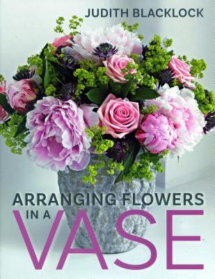 Arranging Flowers in a Vase By Judith Blacklock Cover Image