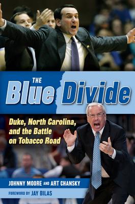 The Blue Divide: Duke, North Carolina, and the Battle on Tobacco Road By Johnny Moore, Art Chansky, Jay Bilas (Foreword by) Cover Image