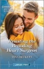 Resisting the Brooding Heart Surgeon: It's Pumpkin Season! Enjoy This Captivating Halloween Inspired Romance. By Tina Beckett Cover Image