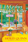 A Crafter Hooks a Killer: A Handcrafted Mystery By Holly Quinn Cover Image