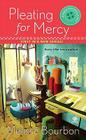 Pleating for Mercy: A Magical Dressmaking Mystery (A Dressmaker's Mystery #1) Cover Image