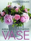 Arranging Flowers in a Vase Cover Image