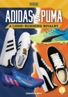 Adidas vs. Puma: A Long-Running Rivalry (Versus) By Kenny Abdo Cover Image