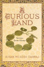 A Curious Land: Stories from Home (Grace Paley Prize in Short Fiction) By Susan Muaddi Darraj Cover Image