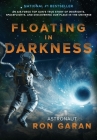 Floating in Darkness: An Air Force Top Gun's True Story of Dogfights, Spaceflights, and Discovering Our Place in the Universe Cover Image