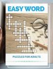 Easy Word Puzzles For Adults: Easy Puzzles and Brain Games, Find the Differences Spot the Odd One Out Includes Word Searches and Much More. Cover Image