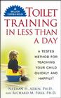 Toilet Training in Less Than a Day By Nathan Azrin Cover Image