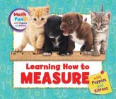 Learning How to Measure with Puppies and Kittens (Math Fun with Puppies and Kittens) By Eustacia Moldovo (Revised by), Patricia J. Murphy Cover Image